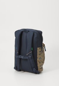 Navy blue backpack with tan patterned accents, adjustable straps, and a textured back panel. Zippered compartment on top.