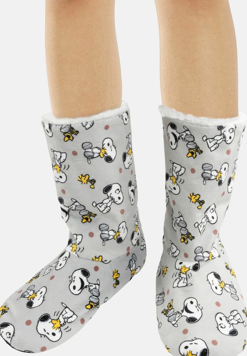 Pantofole in pile grigio con fodera bianca, caratterizzate da motivi di Snoopy e Woodstock in nero e giallo, con pois in diverse tonalità.
