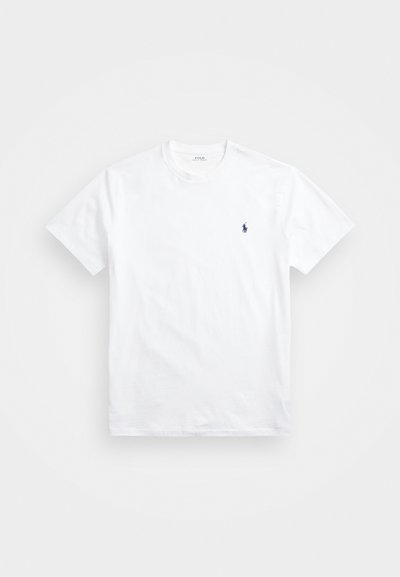 T-shirt de algodão branco com decote redondo, mangas curtas e um pequeno logotipo da polo em azul marinho no lado esquerdo do peito. Textura suave, corte clássico.