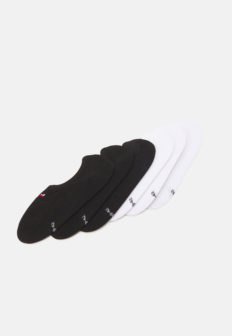 Three pairs of low-cut socks in black and white, made of a soft fabric. Each sock features a small brand logo on the side.