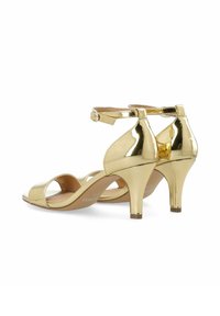 Sandali con tacco alto in vernice dorata, dotati di cinturino alla caviglia, design open-toe e tacco di 6,5 cm. Texture liscia e silhouette incurvata.