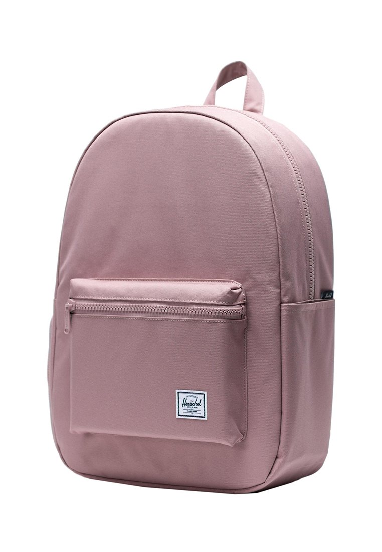 Rosa Herschel-Rucksack mit frontaler Reißverschlusstasche, Seitentaschen, einem Tragegriff an der Oberseite und einem Hauptreißverschlussfach.