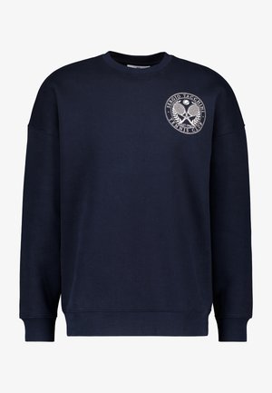 Felpa navy con maniche lunghe, scollatura a girocollo e un logo circolare stampato con racchette da tennis sul lato sinistro del petto. Tessuto in misto cotone.