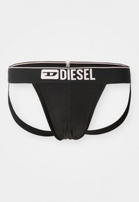 Fekete Diesel férfi jockstrap fehér logóval az elasztikus derékpánton és elasztikus lábszíjakkal, fehér háttér előtt.