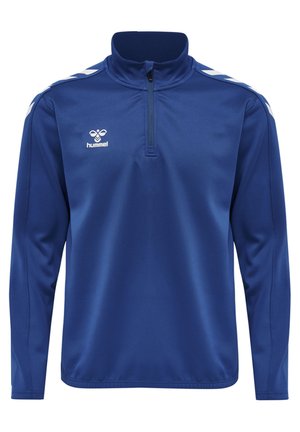 Pull à manches longues à col zippé à quart en tissu bleu uni. Présente des rayures diagonales blanches contrastantes sur les épaules et un petit logo à l'avant.