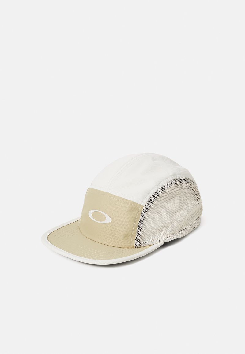 White and beige cap featuring a curved brim, mesh side panels, and an emblem logo on the front. Material appears lightweight and breathable.