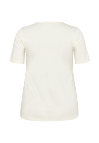 Camiseta de manga corta color crema claro con escote redondo, textura suave y corte clásico. Sin logotipos ni patrones visibles.