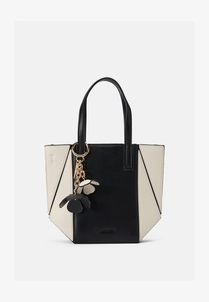 Geantă tote din piele neagră și crem cu design geometric, mânere scurte și accesorii din aur. Include un charm floral atașat printr-un lanț.