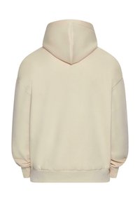 Cream-colored hooded sweatshirt with a relaxed fit, featuring a soft texture, dropped shoulders, and ribbed cuffs and hem.
