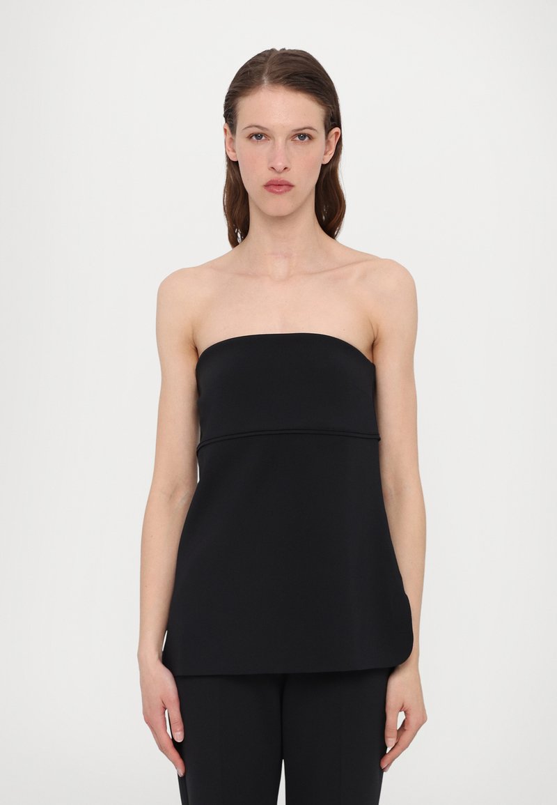 Svart bustier topp laget av glatt stoff, med en tettsittende bodice og løs passform i livet. Sømdetaljer gir en subtil struktur.