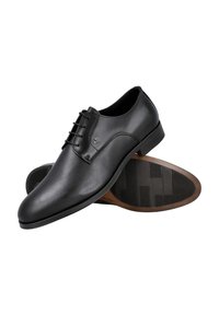 Zapatos de vestir de piel negros con un diseño elegante, con puntera afilada, cierre con cordones y suela de goma texturizada.