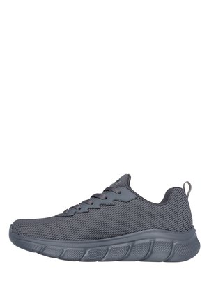 Scarpa da atletica leggera grigio scuro con tomaia in mesh e suola strutturata, chiusura con lacci e linguetta sul tallone.