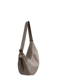 Borsa a tracolla khaki realizzata in tessuto morbido. Presenta una larga tracolla regolabile e un design minimalista. Include un piccolo logo accentato colorato.