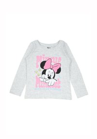 T-shirt gris à manches longues ornée d'un design de personnage de dessin animé avec un nœud rose, complété par un texte rose et bleu et des détails d'emoji ludiques.