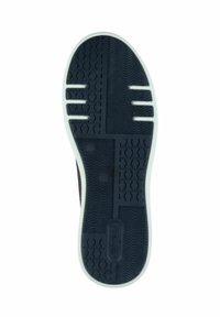 Semelle de chaussure en caoutchouc noir avec un motif texturé et une bordure blanche. Présente divers motifs de traction et des découpes pour plus de flexibilité.