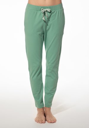 Groene katoenen joggerbroeken met een elastische tailleband en een gestreepte trekkoord. De pijpen zijn taps toelopend en er zijn zijzakken.