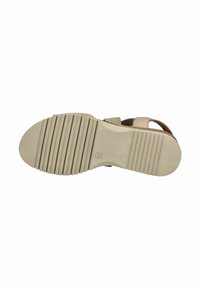 Tan Sandale mit einer strukturierten, beigen Gummisohle. Verfügt über einen breiten Riemen und einstellbares Band für einen sicheren Sitz. Glatte Oberfläche, minimalistisches Design.