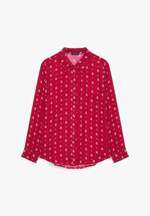 Rote Bluse mit langen Ärmeln, Knopfleiste, weißem Paisley- und kleinen Punktmuster, spitzem Kragen und manschettenartigen Ärmeln.