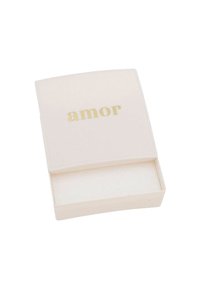 White cardboard box with a curved top, featuring the word "amor" in gold lettering on the lid and a soft interior.