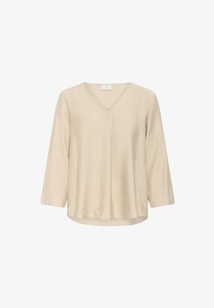 Bluză texturată bej, cu decolteu în V, mâneci trei sferturi și croială lejeră. Material moale cu o luciu subtil și hem îndoielnic.