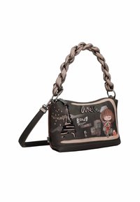 Bolso con asa trenzada, tejido oscuro, gráficos de dibujos animados de la Torre Eiffel y una chica, con acentos en rosa claro y cierre de cremallera.
