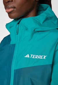 Adidas Terrex RAIN  - Vandeniui atspari striukė - mystery green/pure teal