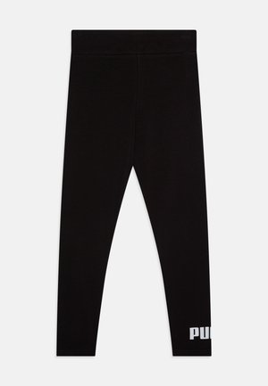 Leggings neri realizzati in tessuto morbido, con una forma aderente e una vita elasticizzata. Stampa del logo bianco nella parte inferiore della gamba sinistra.