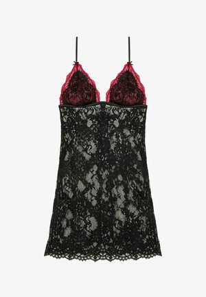 Nuisette en dentelle noire avec des bonnets en dentelle rouge, bretelles ajustables et ourlet festonné. Présente des motifs floraux dans le design de la dentelle.