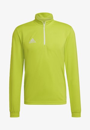 Helle limonengrüne Sportjacke mit Reißverschluss und Stehkragen, ausgestattet mit langen Ärmeln und Rippakzenten an den Bündchen. Adidas-Logo in Weiß.