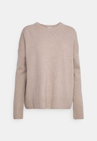 Beżowy sweter wykonany z miękkiego dzianiny. Posiada okrągły dekolt, opadające ramiona oraz ściągacze przy mankietach i na dole dla luźniejszego fasonu.