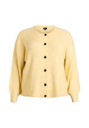 Dzeltena kardigans ar ribotu tekstūru, apaļu kaklu un melnām pogām priekšpusē. Brīva piegriezuma ar garām piedurknēm un taisnu apakšmalu.