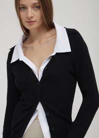 Calliope Strickjacke - noir