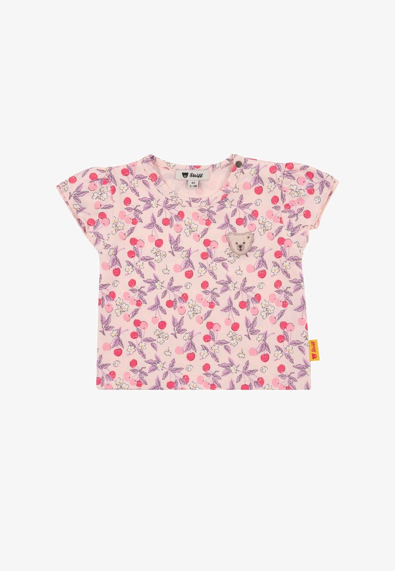 Camicia a maniche corte in cotone rosa chiaro con motivo floreale con ciliegie e piccoli fiori. Include una toppa a forma di faccia di orso sul davanti.