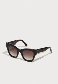 Gafas de sol cuadradas carey con lentes degradados, acabado brillante y un acento dorado en el lateral. Bisagras robustas y patillas anchas.