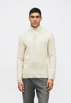 Lichtbeige zip-necksweater van zacht materiaal. Heeft lange mouwen, ribgebreide manchetten en zoom met een minimalistisch ontwerp.