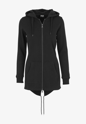 Sudadera de cremallera negra con mangas largas, bolsillos frontales, capucha con cordón y un dobladillo trasero más largo. Hecha de material suave y cómodo.
