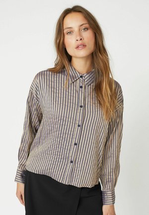 Beige shirt with vertical navy stripes, button-up front, collar, and long sleeves. Soft, lightweight fabric with slight sheen.
