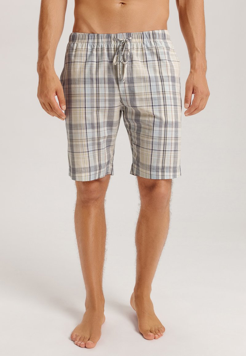 Pantalones cortos de cuadros en tonos beige, azul y gris, fabricados con un tejido ligero. Presentan una cintura elástica con cordón para un ajuste ajustable.
