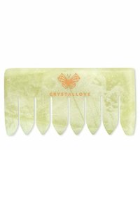 Groene jade kam met acht taps toelopende tanden. Gladde textuur en natuurlijk aderenpatroon. Heeft het "CRYSTALLOVE" logo in oranje.