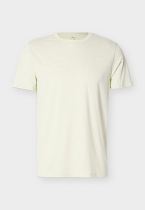 Kremfarget t-skjorte med korte ermer og rund hals, med en subtil hvit Puma-logo av en hoppende puma midt på forsiden.