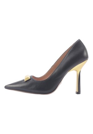 Black leather high-heeled shoe with pointed toe and gold-accented heel. Features a geometric detail at the vamp. Smooth texture.