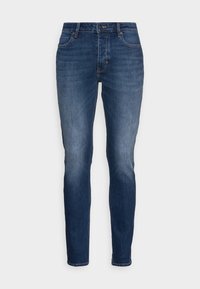 Mörkblå slim-fit jeans med frontknapp och dragkedja, klassisk femfickdesign och subtil blekning vid låren och knäna.