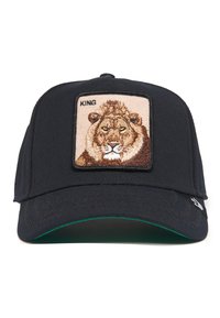 Gorra de béisbol azul marina con un parche rectangular color beige que presenta un león bordado y la palabra "REY" arriba. Tejido texturizado y visera.