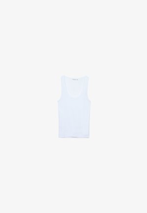 White cotton tank top, features a round neckline and wide shoulder straps. Smooth texture, sleeveless design, and a fitted silhouette.