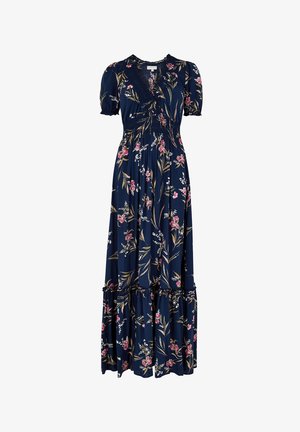 Marinblå blommig maxiklänning i lätt tyg, med en volangkant, korta puffärmar och V-halsringning med en figurnära överdel.