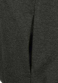 Dark gray fabric with a soft texture. Features a vertical slit detail, adding dimension to the design. Suitable for casual wear.