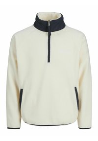 Fleece-Pullover in Creme mit einem marineblauen Kragen und Reißverschluss, ausgestattet mit seitlichen Taschen und kontrastierendem schwarzen Besatz für zusätzliche Haltbarkeit.