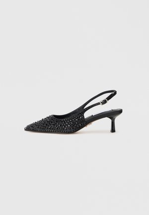 Black slingback kitten heel shoe with pointed toe and covered in small black rhinestones on a white background.