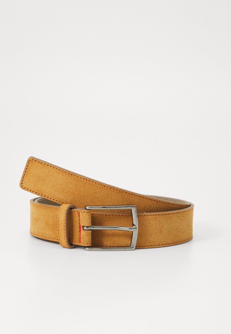 Tan suede belt with a rectangular silver metal buckle and a red accent on the loop. Features a smooth texture and flat edge design.