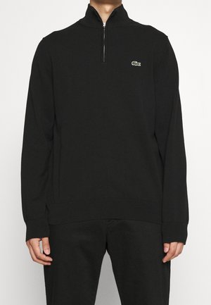 Stickad tröja - black